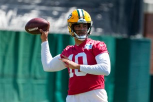 Green Bay Packers' Jordan Love throwing a football during a practice session in Green Bay, Wisconsin on June 12, 2024