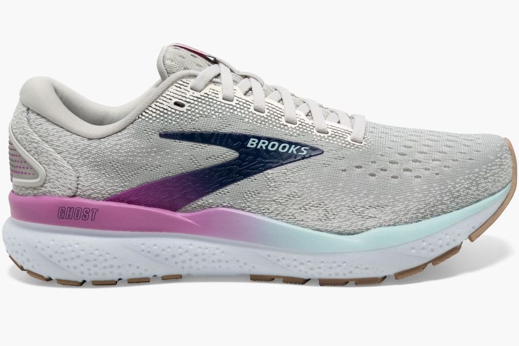 A pair of Brooks running sneakers in grey and purple.