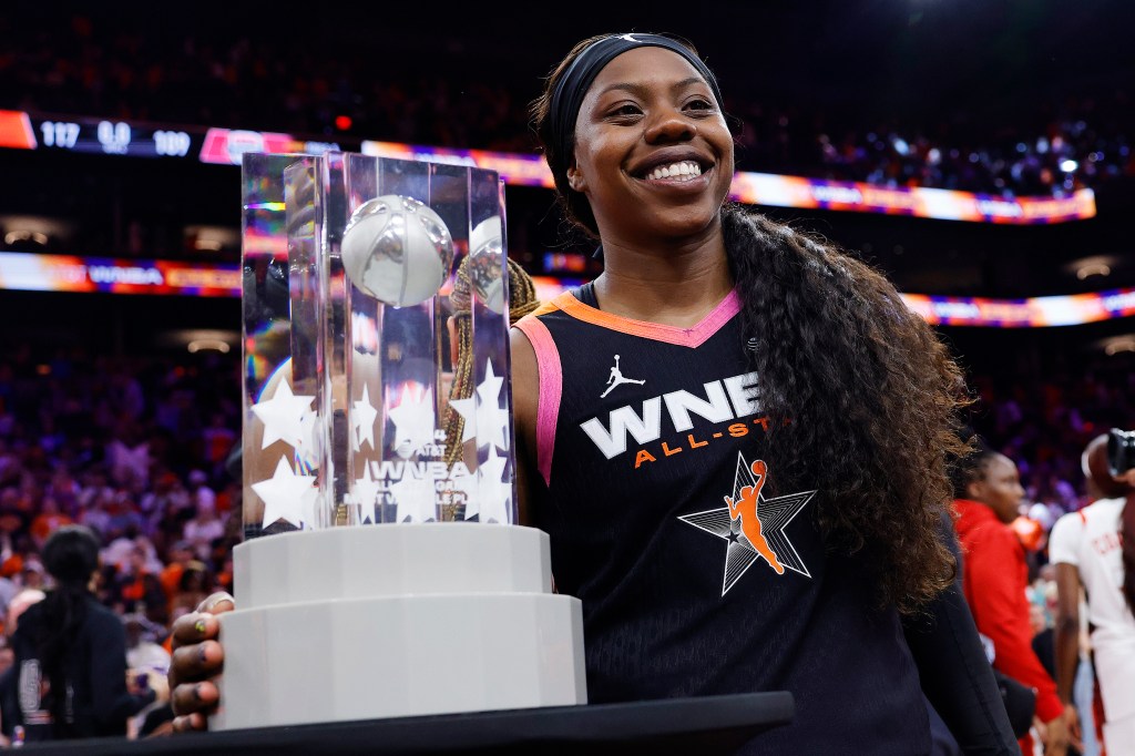 Arike Ogunbowale #24 of Team WNBA celebrates with the MVP trophy after beating Team USA 117-109 during the 2024 WNBA All Star Game at Footprint Center on July 20, 2024 in Phoenix, Arizona.  