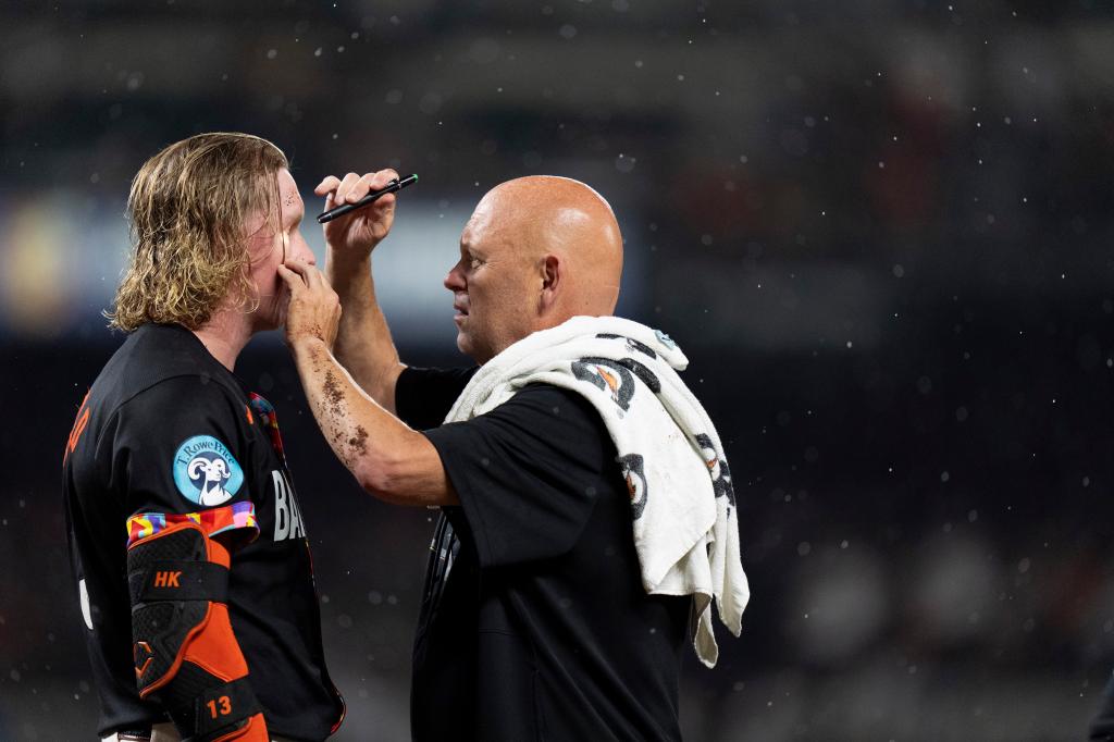 Heston Kjerstad (L.) was hit in the head by a pitch during the Orioles' loss to the Yankees on July 12, 2024. 