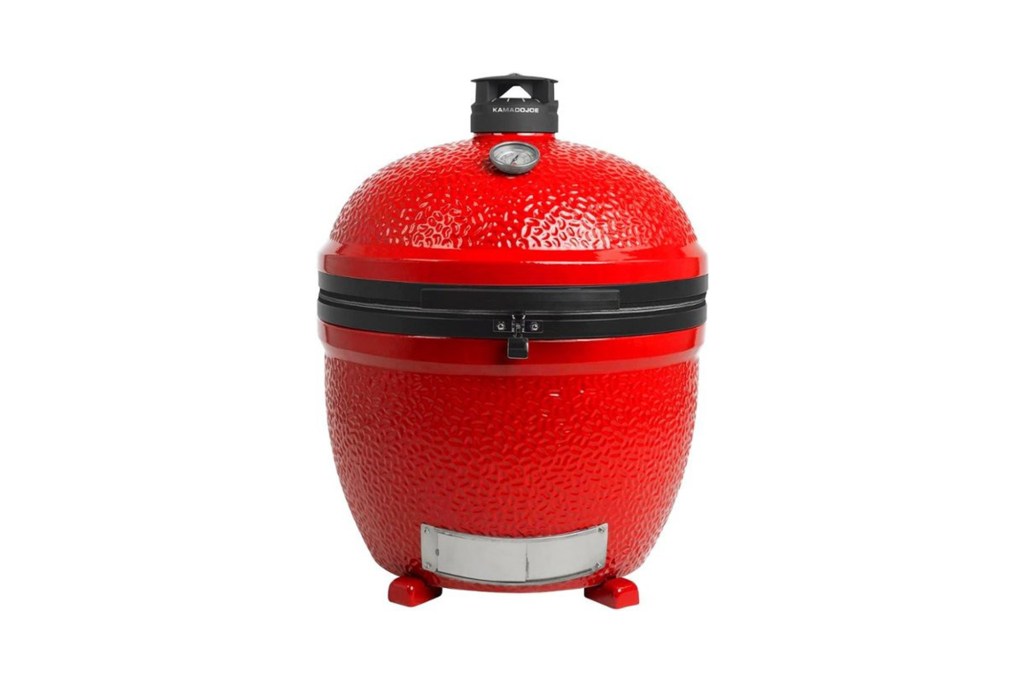 Red round grill with a black handle