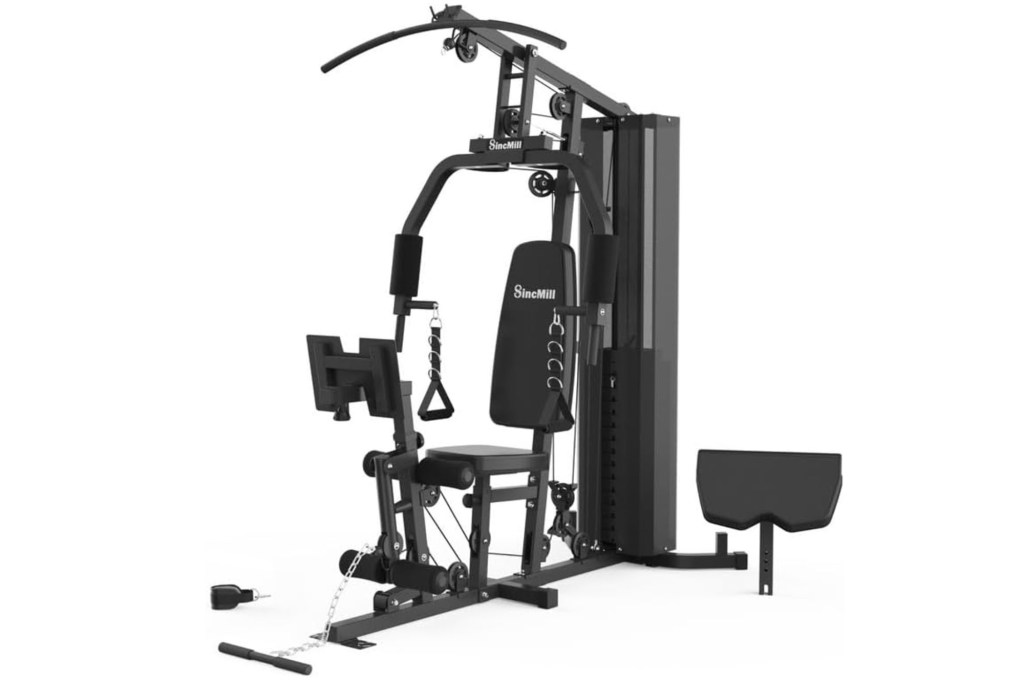 A black exercise machine with a black stand in a home gym.