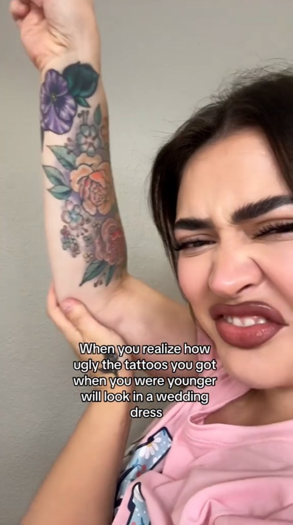 TikTokker expressing tattoo regret, holding up sleeve of flowers for the camera