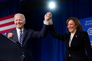 President Joe Biden and Vice President Kamala Harris stand on stage at the Democratic National Committee winter meeting, Feb. 3, 2023, in Philadelphia.