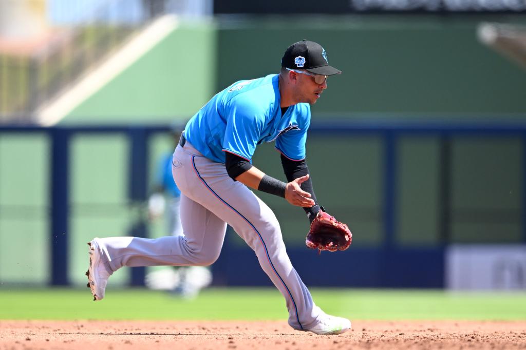 José Iglesias #13 of the Miami Marlins fielding a ground ball during a spring training game against the Washington Nationals