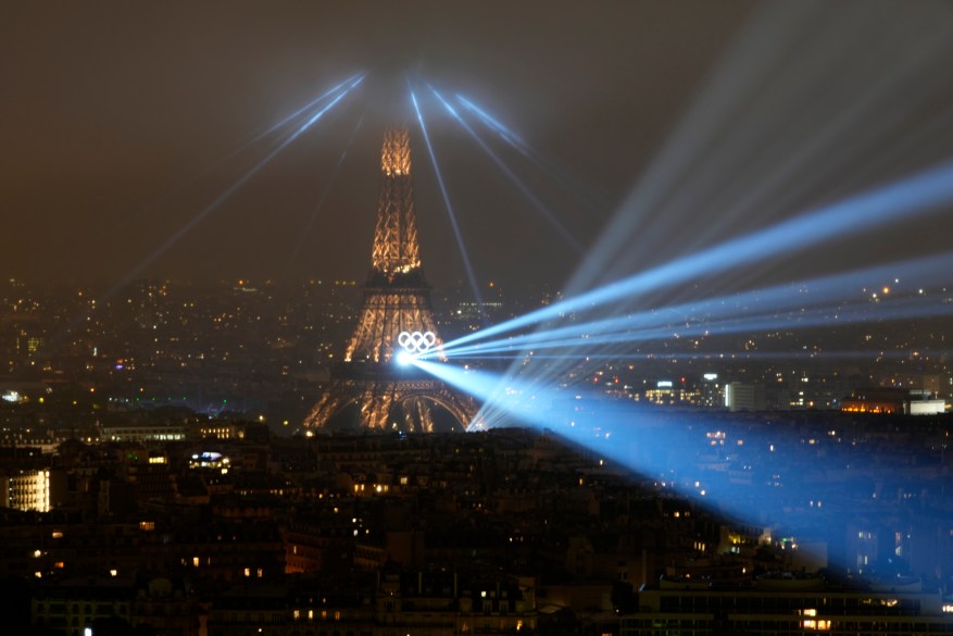 The Eiffel Tower is illuminated during the opening ceremony.