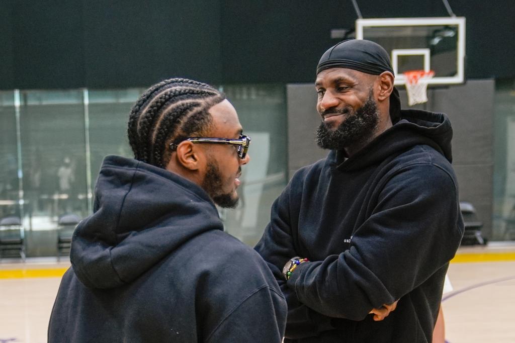 LeBron James (r.) and his son Bronny (l.) during Bronny's Lakers introductory news conference on Tuesday.