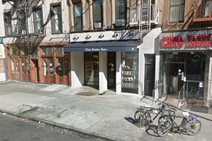 A butcher shop on a busy avenue as seen through google street view.