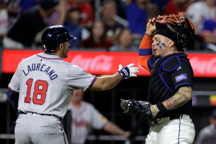 Francisco Alvarez (R.) reacts during the Mets' win over the Braves on July 25, 2024. 