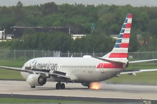 Terrifying moment plane's tire bursts into flames during takeoff.