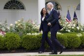 President Joe Biden walks with Vice President Kamala Harris in the Rose Garden of the White House, May 13, 2021, in Washington.