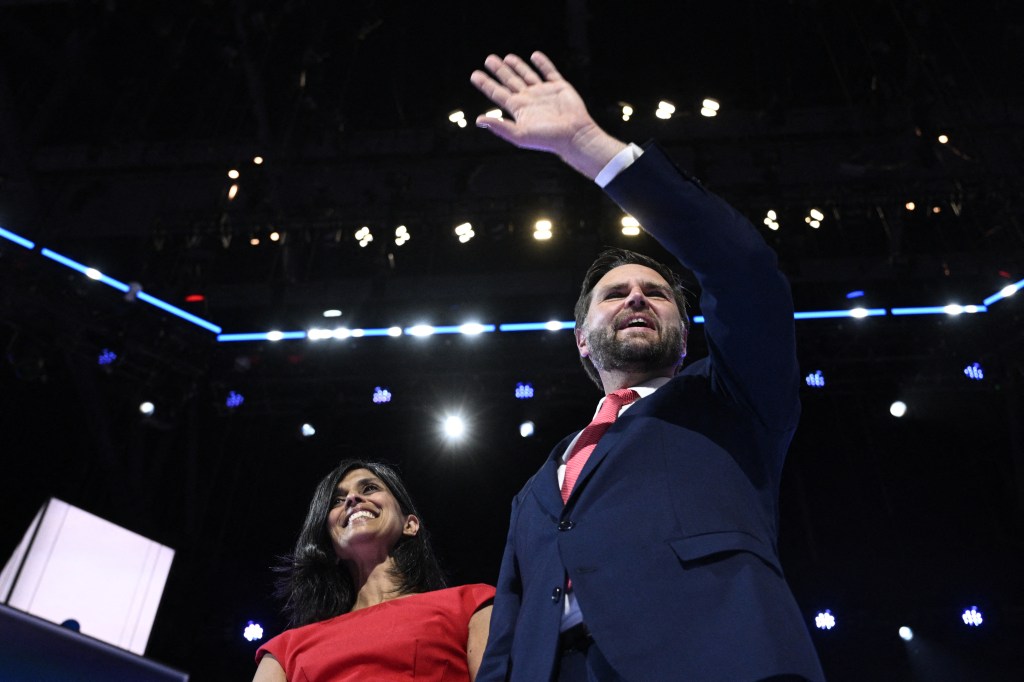 US Senator from Ohio and 2024 Republican vice presidential candidate J.D. Vance waves onstage next to wife US lawyer Usha Vance (L) during the last day of the 2024 Republican National Convention at the Fiserv Forum in Milwaukee, Wisconsin, on July 18, 2024. 