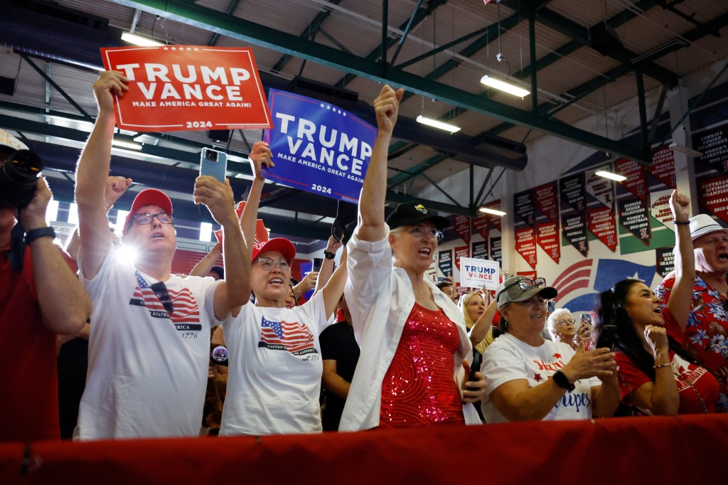 Audience members listen as Republican vice presidential nominee U.S. Sen. J.D. Vance (R-OH) speaks at a campaign rally at Liberty High School on July 30, 2024 in Henderson, Nevada. 