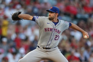 David Peterson #23 of the New York Mets throws a pitch.