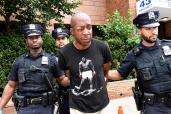 NYPD officers from the 43 precinct walk Ernst Delma, 41, after he was arrested yesterday leading to the assault of a female officer.