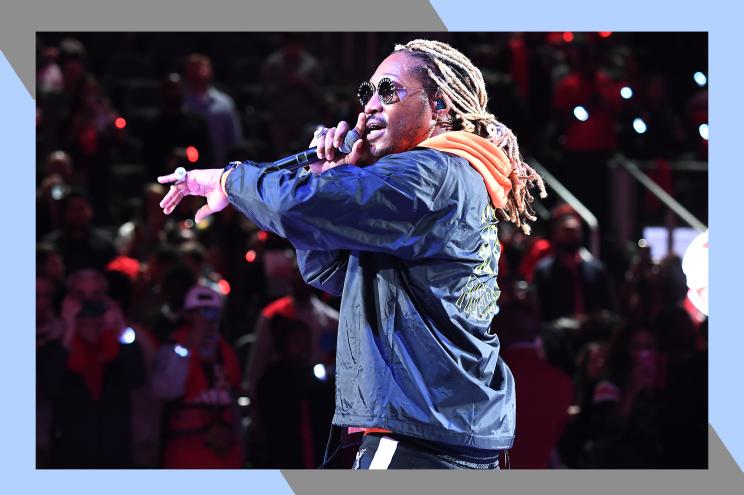 Future performs onstage with a microphone in hand.