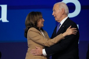 President Joe Biden speaks and Vice President Kamala Harris during the first day of the Democratic National Convention at the United Center.