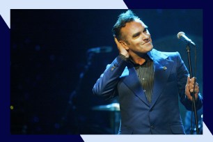 Morrissey strikes a pose while performing onstage.