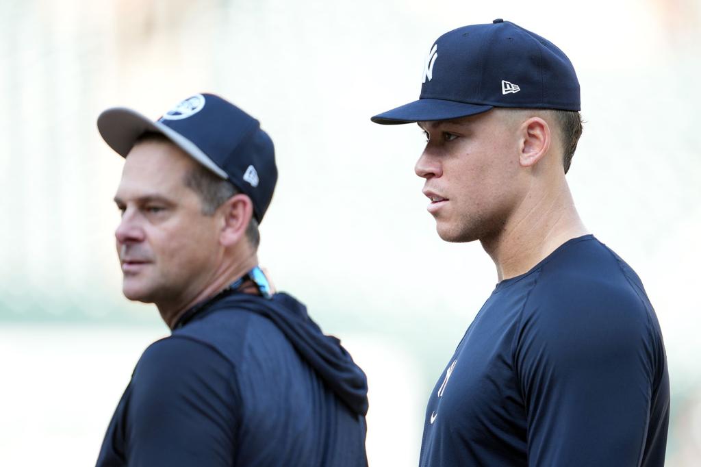 Manager Aaron Boone #1 and Aaron Judge #99 of the New York Yankees talk during batting practice prior to a game against the Baltimore Orioles at Oriole Park at Camden Yards on April 29, 2024 in Baltimore, Maryland