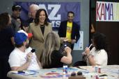 Democratic presidential nominee Vice President Kamala Harris and running mate Minnesota Gov. Tim Walz visit a campaign office, Friday, Aug. 9, 2024, in Phoenix.