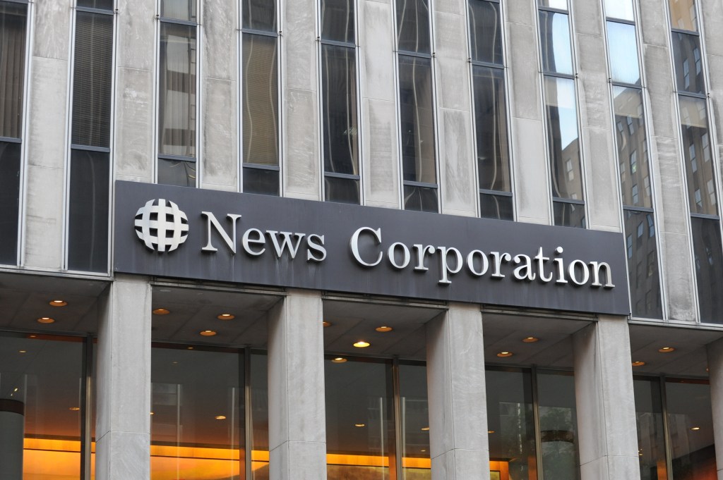 News Corp turned in a 6% increase in fourth-quarter revenue, due in part to strength at its Dow Jones business unit.