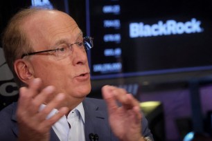 Larry Fink, CEO of BlackRock, giving an interview on the floor of the New York Stock Exchange.