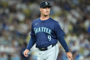 Scott Servais found out by an alert on the television screen that he was fired by the Mariners as their manager.