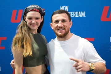 Merab Dvalishvili, posing with a fan during this summer's UFC X fan expo, will challenge Sean O'Malley for the bantamweight title on Sept. 14.