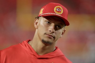 Patrick Mahomes #15 of the Kansas City Chiefs watches preseason game action against the Chicago Bears at GEHA Field at Arrowhead Stadium on August 22, 2024 in Kansas City, Missouri.  