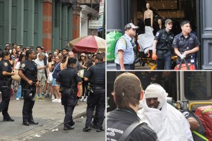 A photo of a large crowd lining the sidewalk and street outside Zara in Soho.