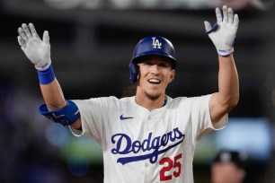 Los Angeles Dodgers' Tommy Edman runs the bases after hitting a home run during the eighth inning of a baseball game against the Chicago Cubs in Los Angeles, Wednesday, Sept. 11, 2024.