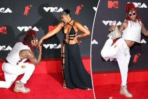 Nick Cannon on bended knee for Ashanti at the 2021 VMAs.