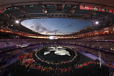 A general view as inside the stadium as athletes participate in the parade during the Closing Ceremony of the Olympic Games Paris 2024 at Stade de France