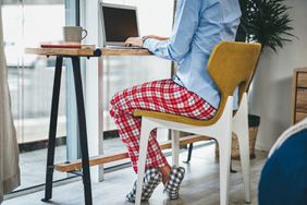 woman using a laptop while working from home