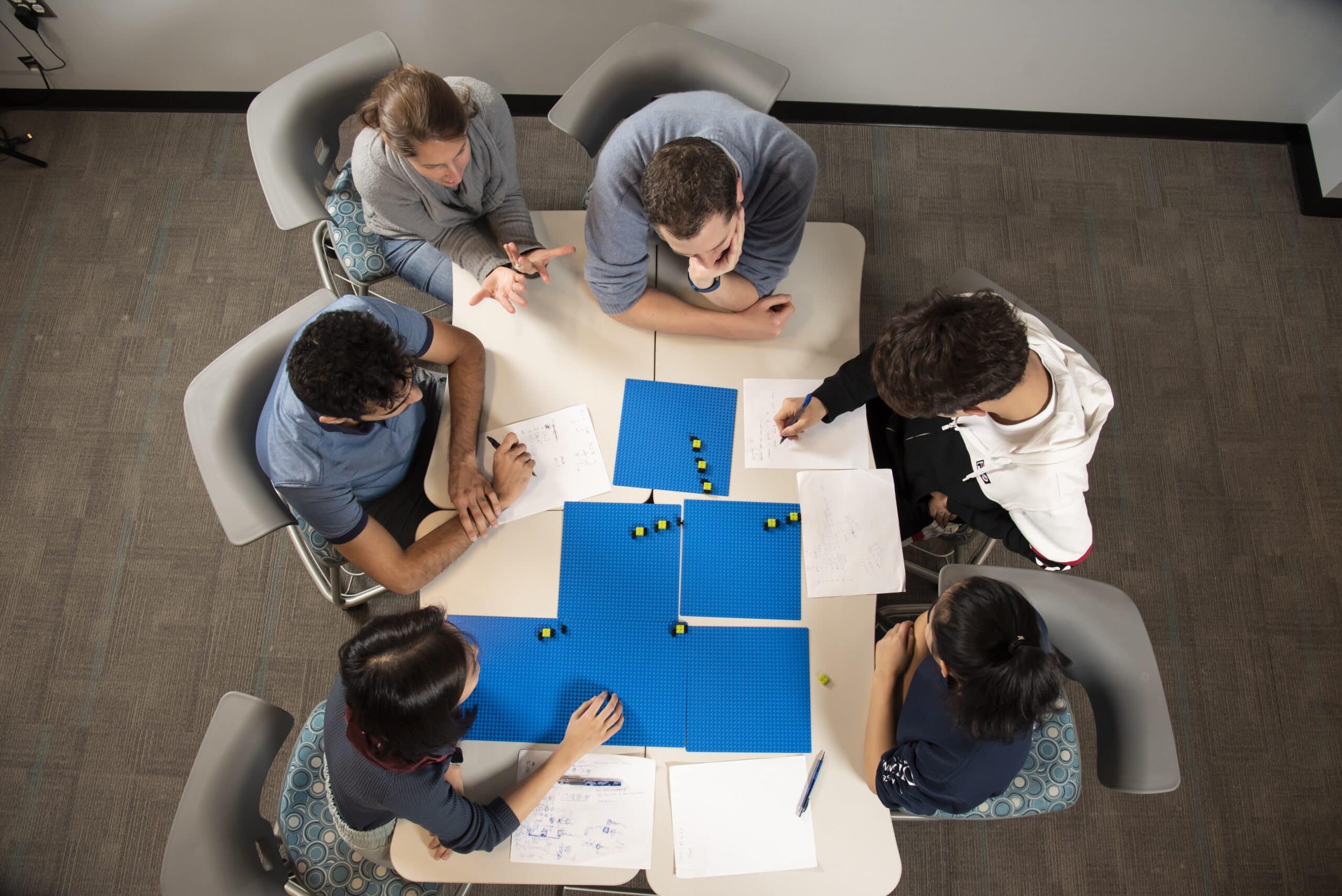 overhead view of students working around a table