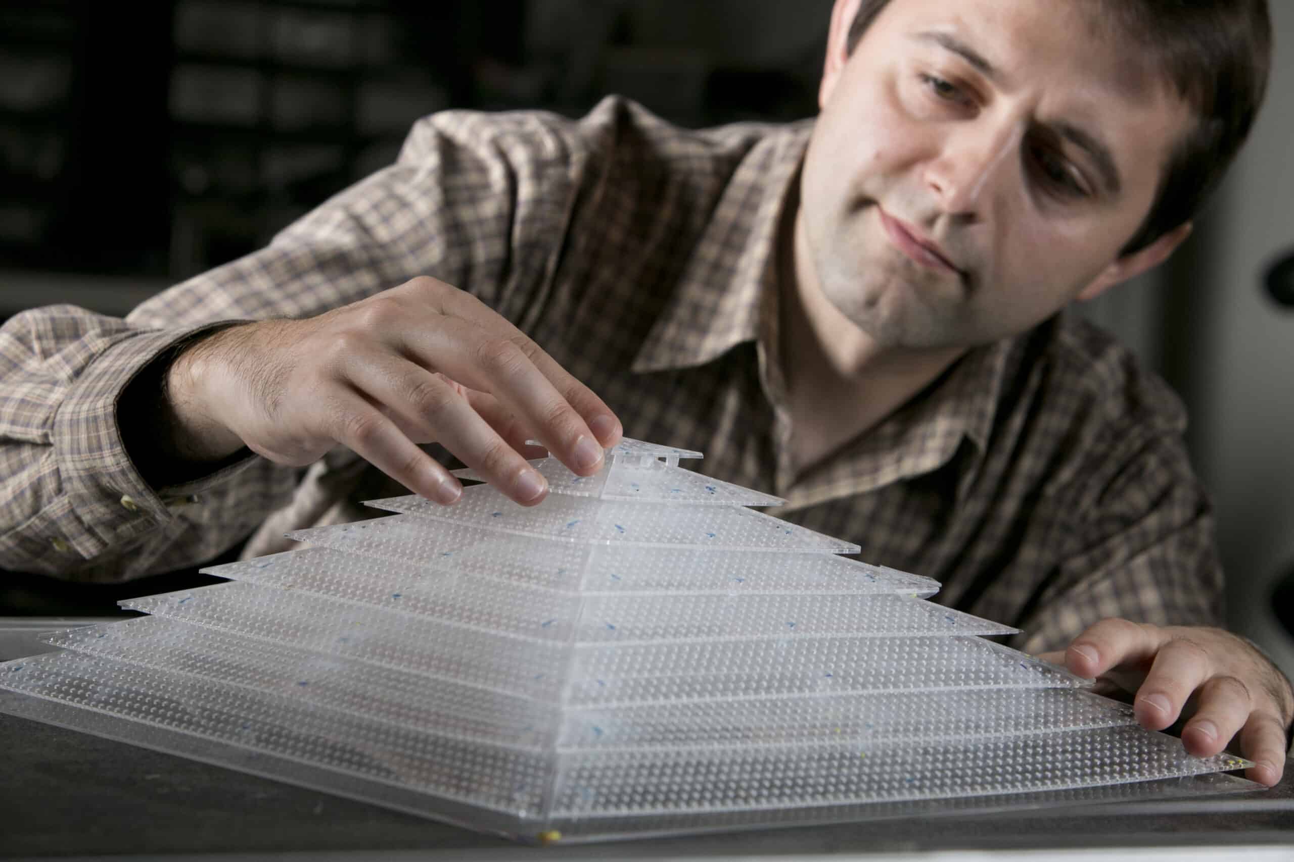 A research touches a pyramidal design of translucent plastic - a metamaterial acoustical cloak