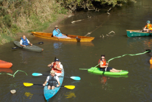 People on canoes in the river