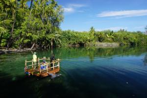 a photo of a boat with people on it in water
