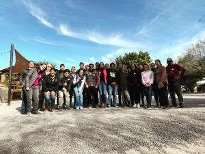 group of people with bright blue sky in the background