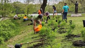 Peole working in grass in SE new england