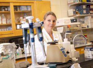 A scientist stands in a laboratory