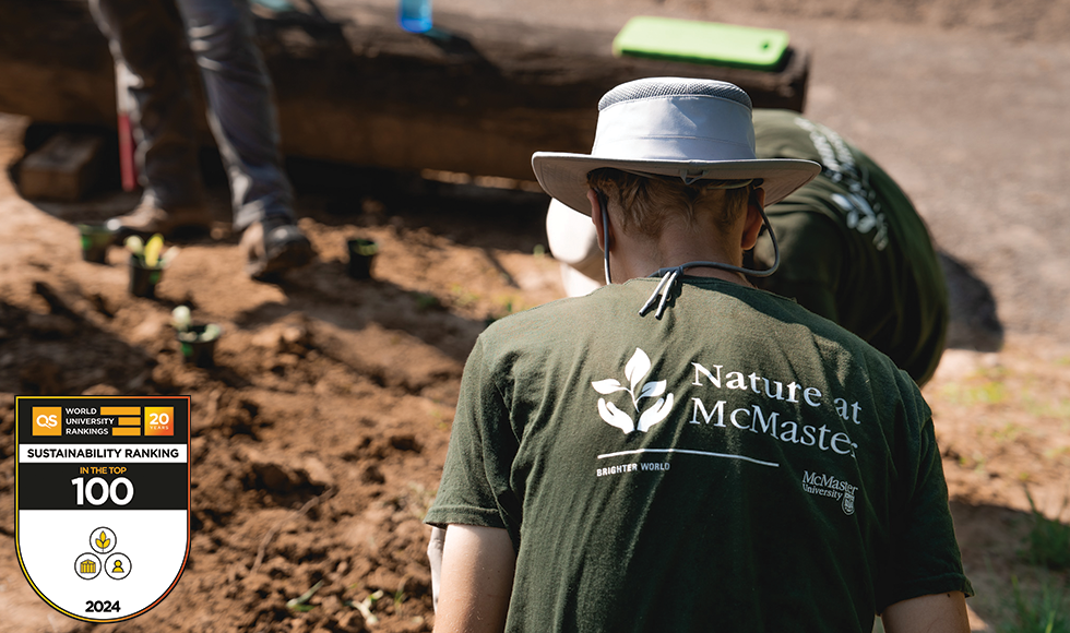 The back of a person wearing a t-shirt that reads Nature at McMaster.