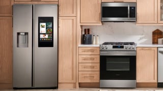 A side-by-side refrigerator in a cleanly-designed modern kitchen.