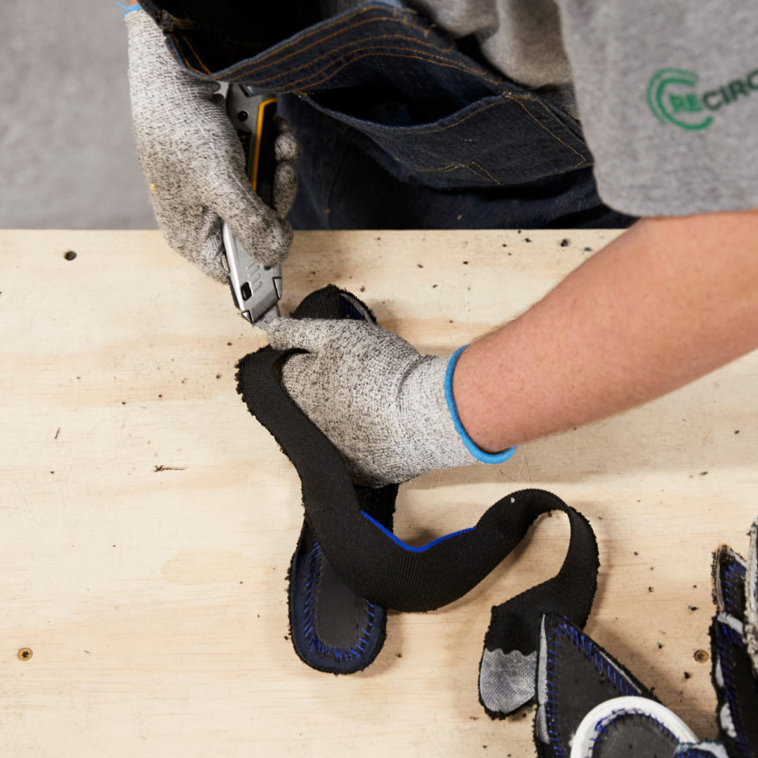 A graphic showing the proccess of taking apart shoes in the factory.