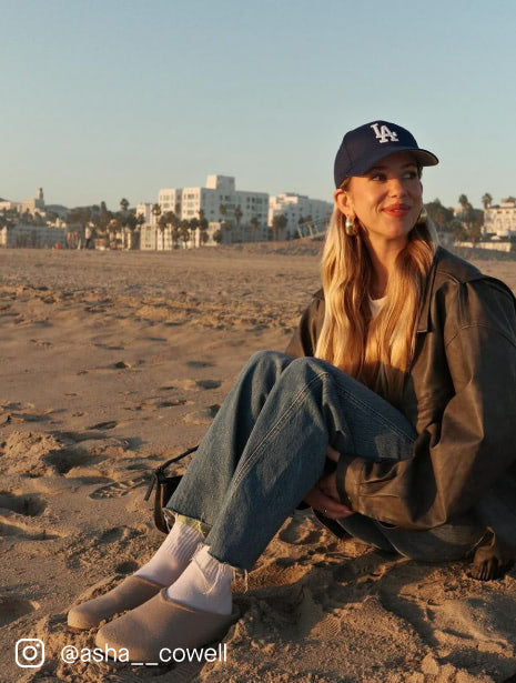 A female model wearing The Casual Clog in Dove.