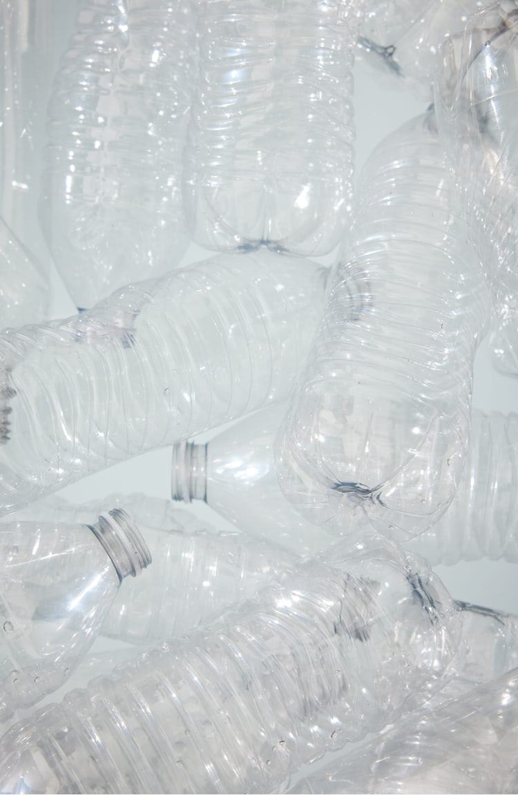 Image depicting close up of recyled plastic water bottles.