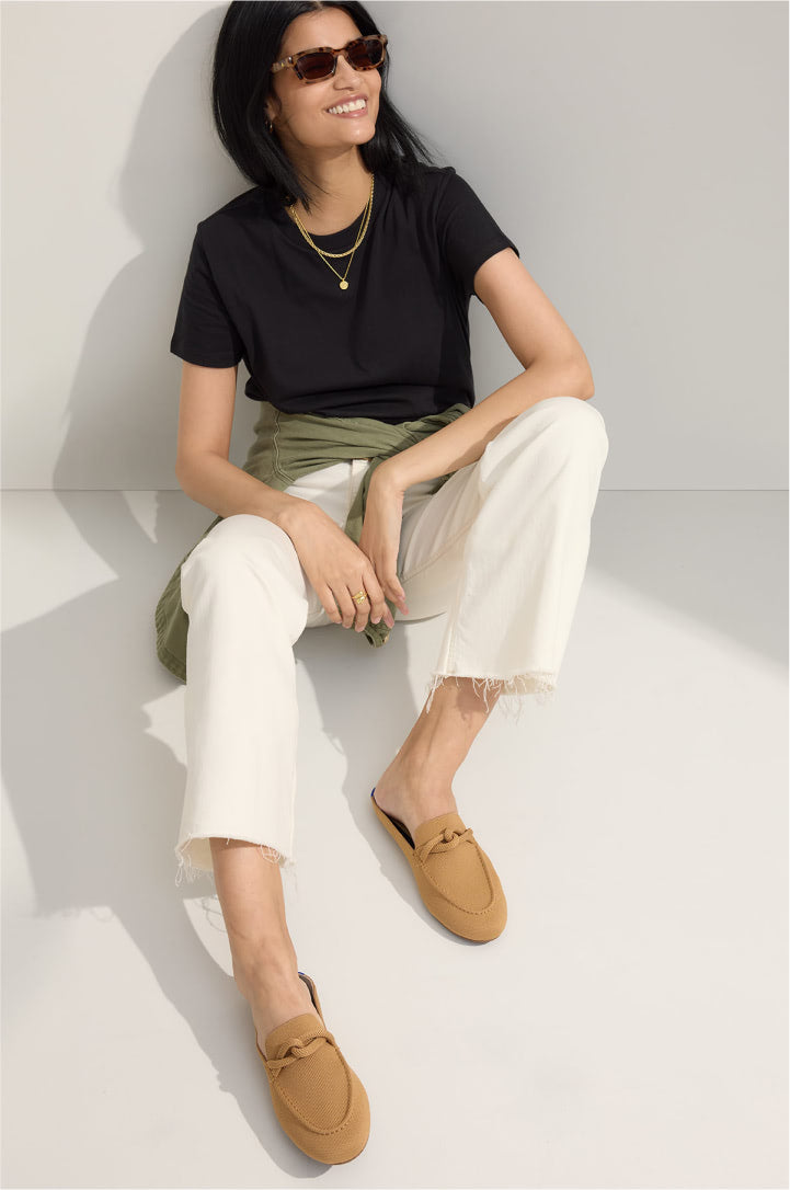 A female model wearing The Loafer Mule in Birdseye