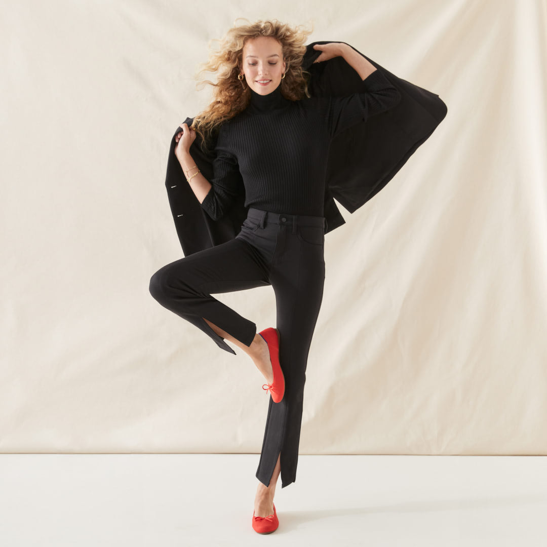 A female model wearing The Ballet Flat in Glamour Red.