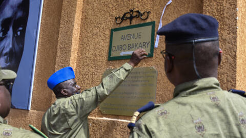 This photograph taken in Niamey on October 15, 2024 shows an official unveiling during a naming ceremony the new plaque where Avenue General Charles de Gaulle was renamed to Avenue Djibo Bakary.