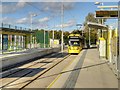 SJ8089 : Outbound Tram Arriving at Moor Road Metrolink Stop by David Dixon